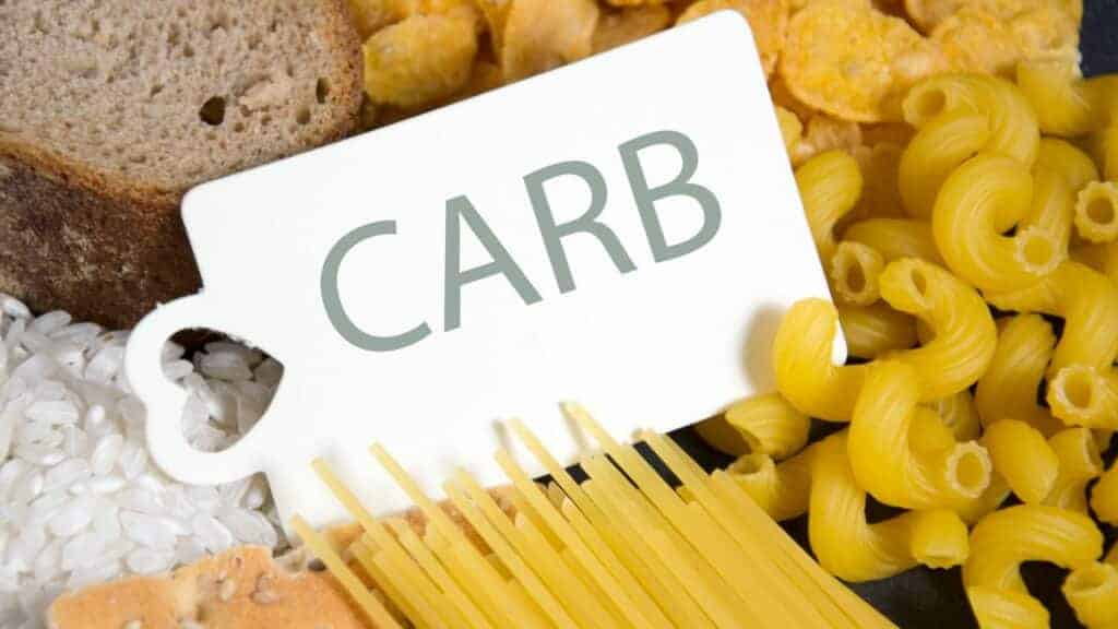 image with pasta in background and a font saying carbs on the front