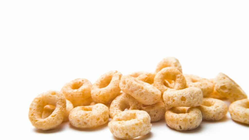 some honey nut cheerios on white background