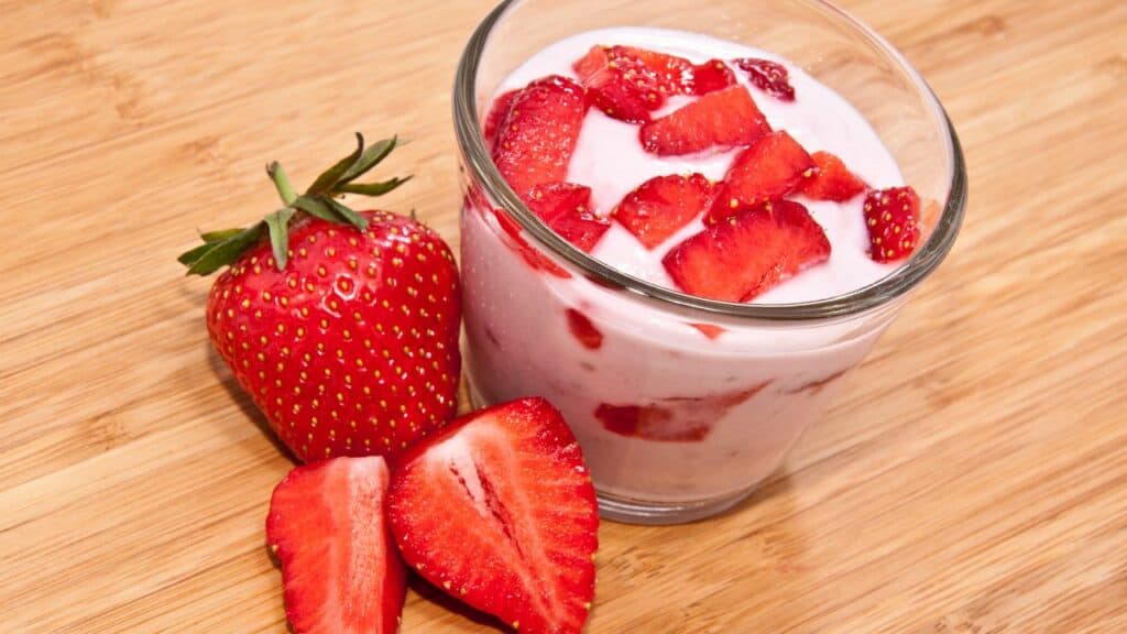 strawberry yogurt in a jar on a table